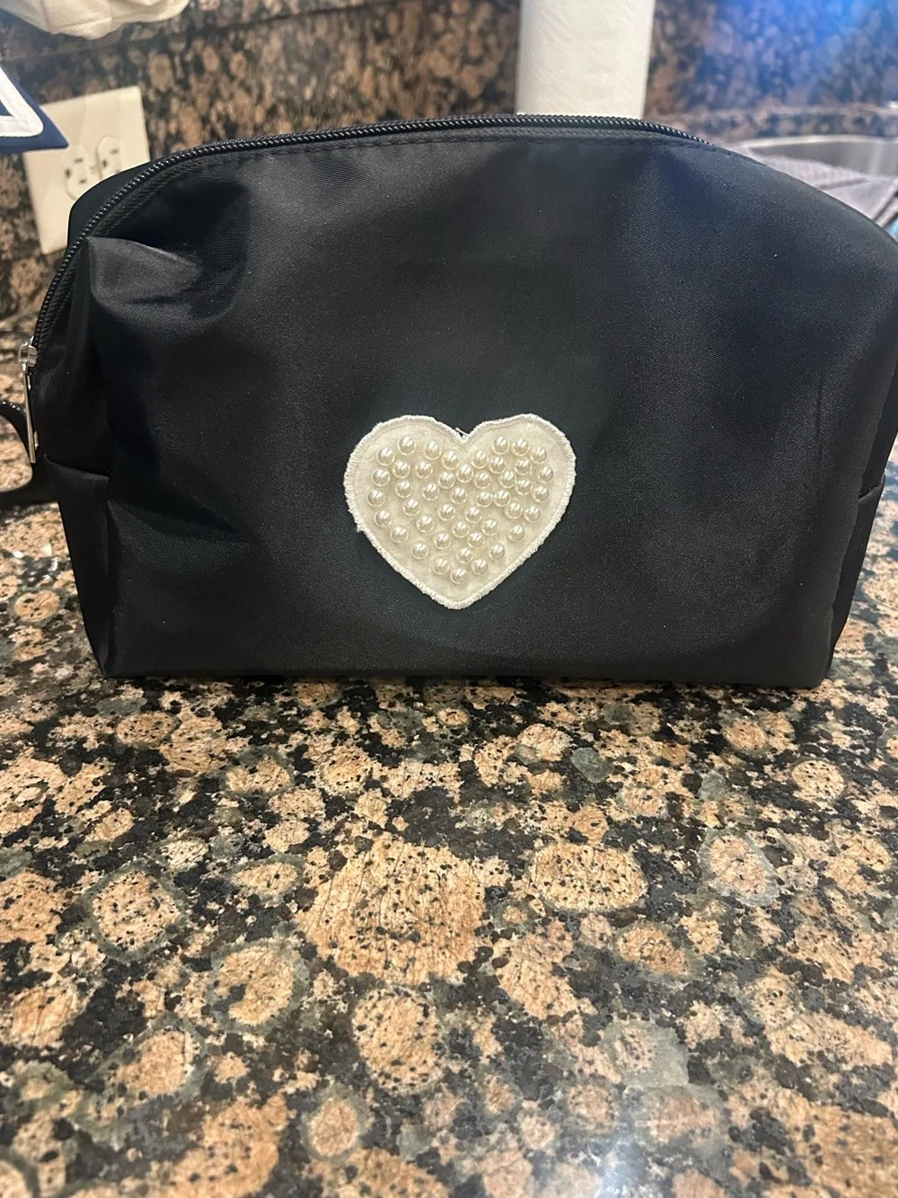 Black and white pearl embellished make up bag